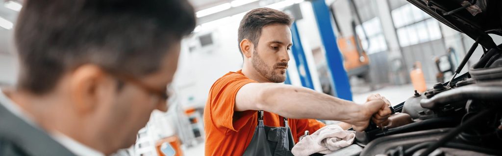 Mechanic performing GMC vehicle service